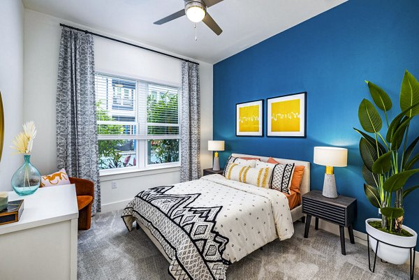 Cozy bedroom with modern furniture in Legacy Encore Apartments