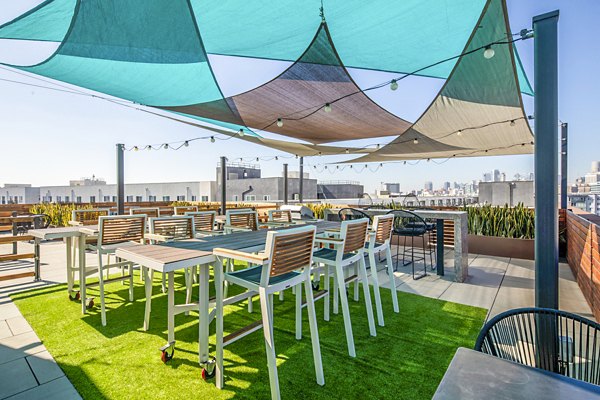 Cozy patio with modern furnishings at Aliso Apartments