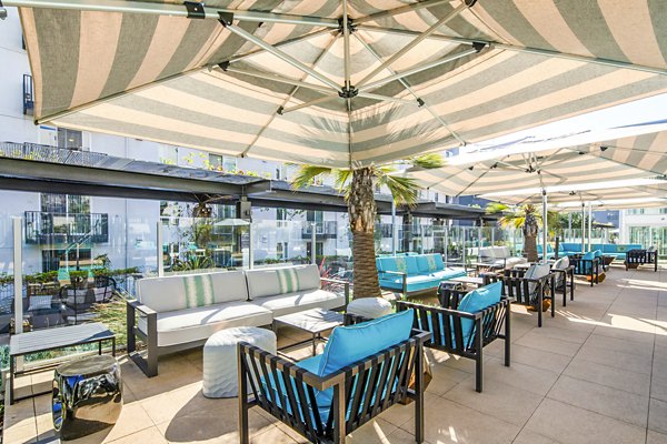 Spacious patio with stylish seating at Aliso Apartments, luxury living in a serene setting