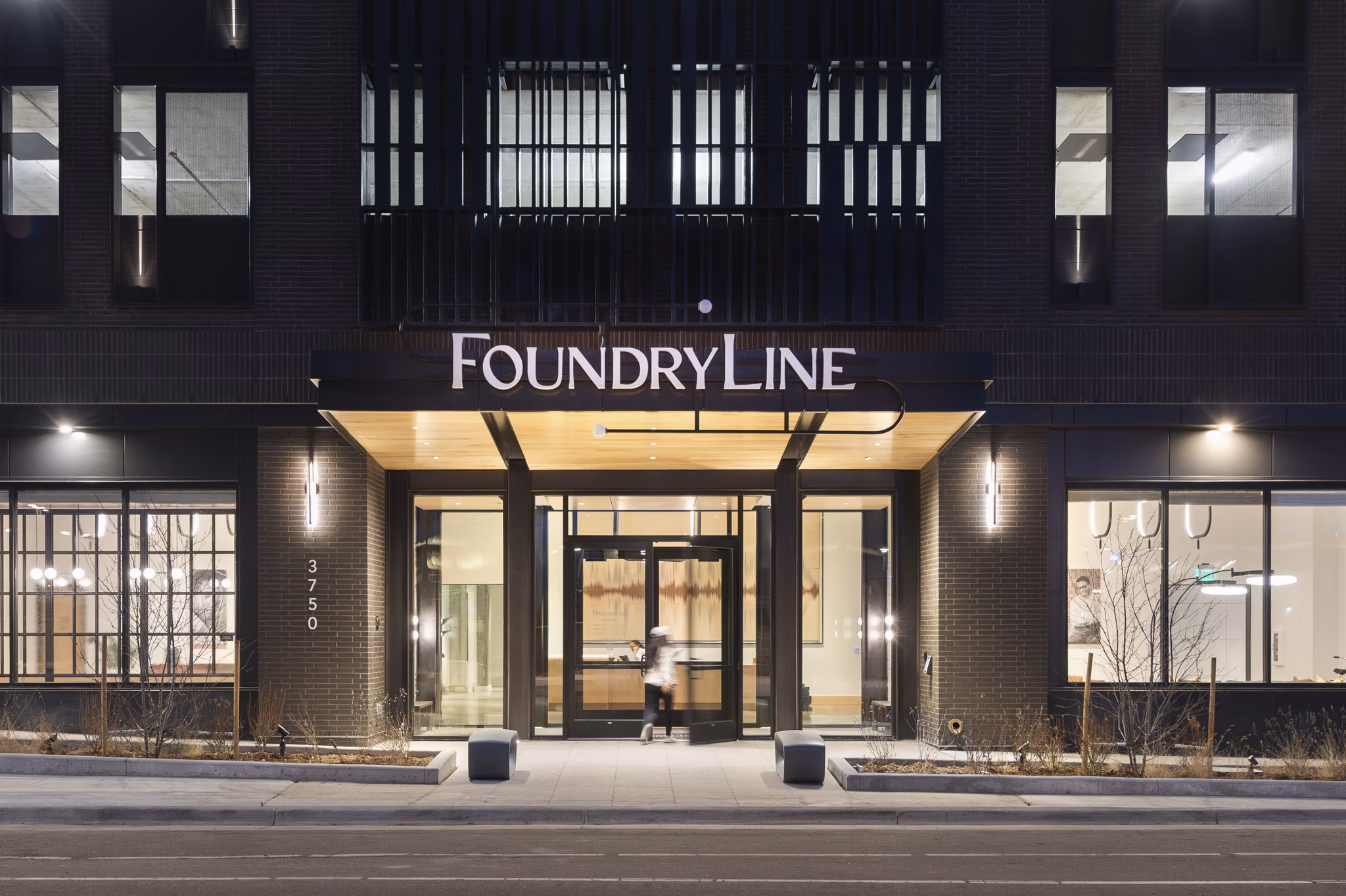 FoundryLine Apartments: Contemporary luxury high-rise building in vibrant urban setting