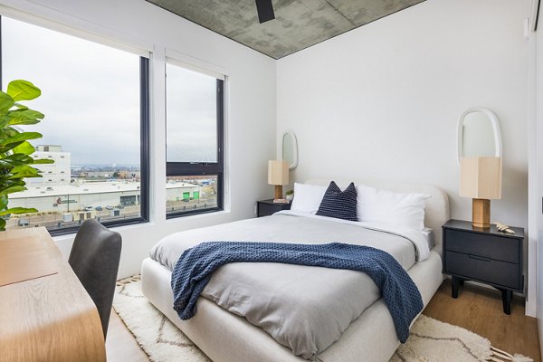 Modern bedroom with stylish furnishings at FoundryLine Apartments, offering luxury living in the heart of the community