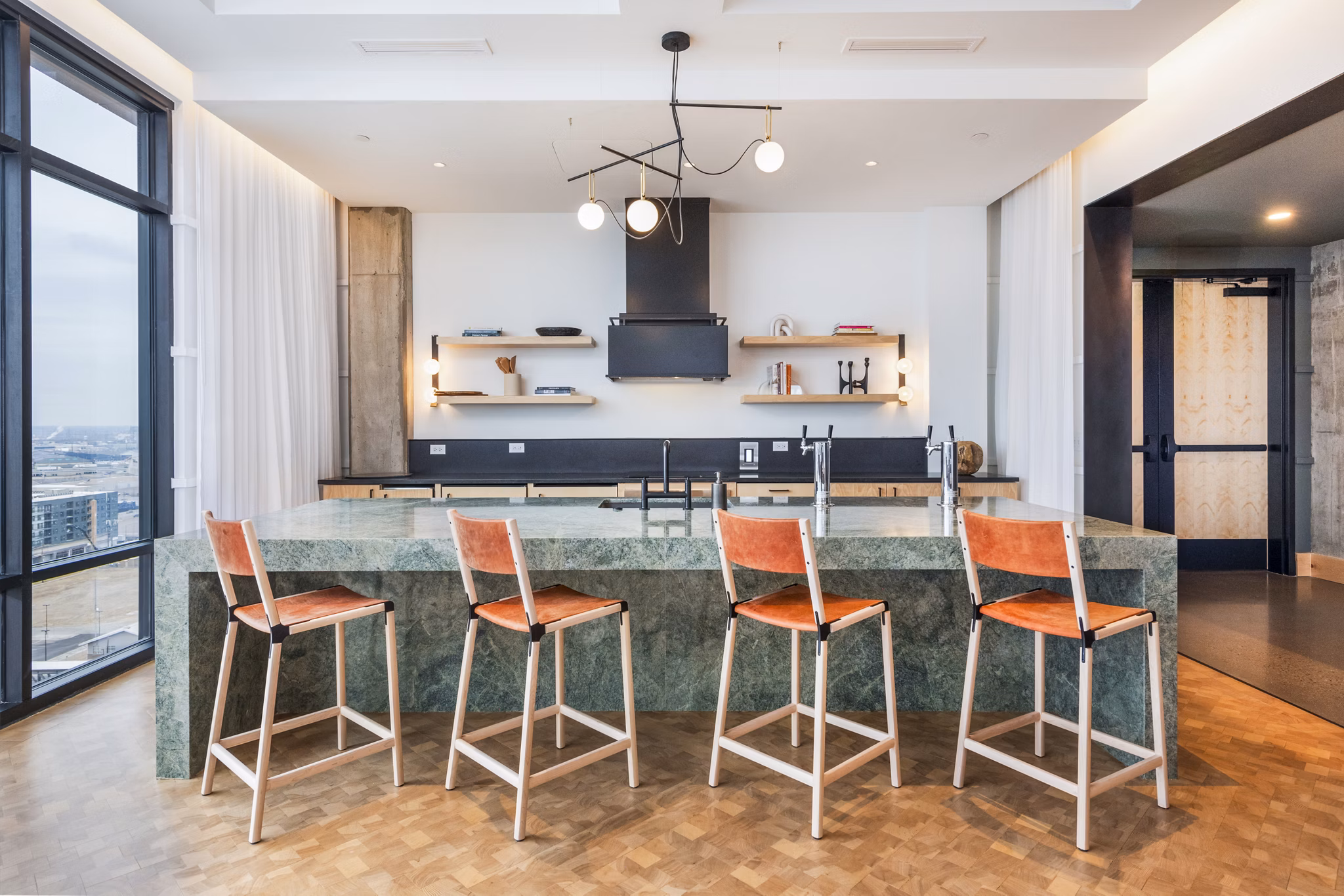 Contemporary clubhouse with modern design elements at FoundryLine Apartments, showcasing luxury living spaces for residents in a vibrant community