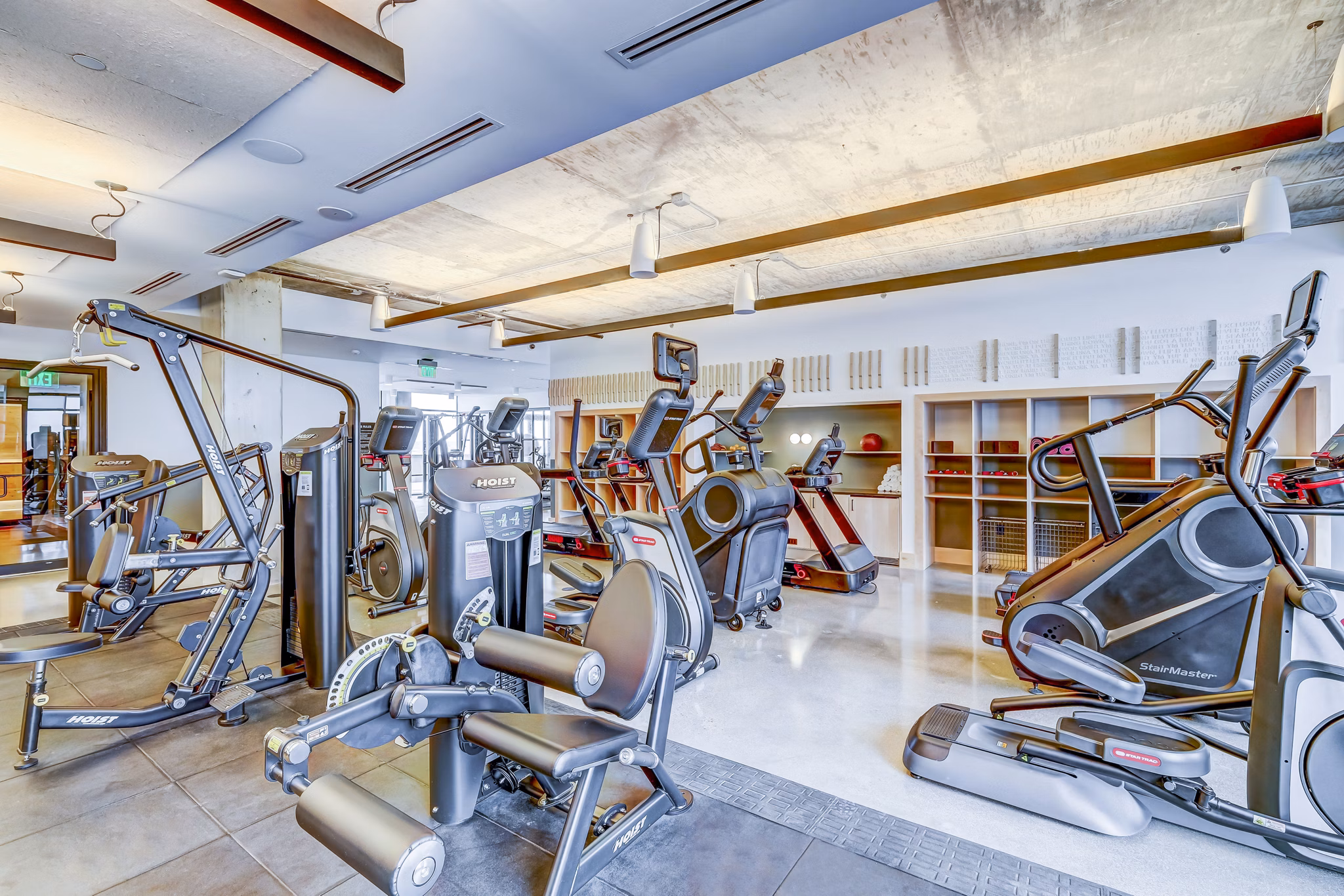 State-of-the-art fitness center with modern equipment at FoundryLine Apartments, offering luxury living in an urban environment