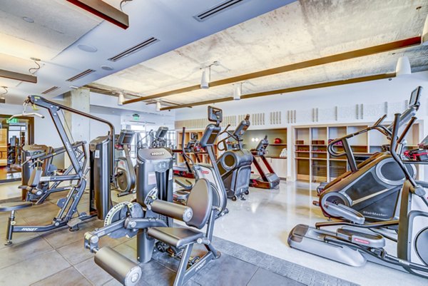 State-of-the-art fitness center with modern equipment at FoundryLine Apartments, offering luxury living in an urban environment
