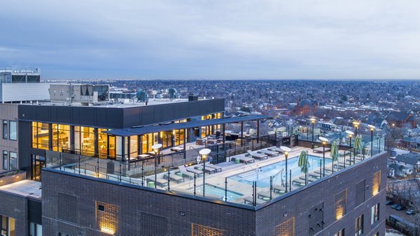 Resort-style pool surrounded by lush landscaping at FoundryLine Apartments, luxury living in the heart of the city
