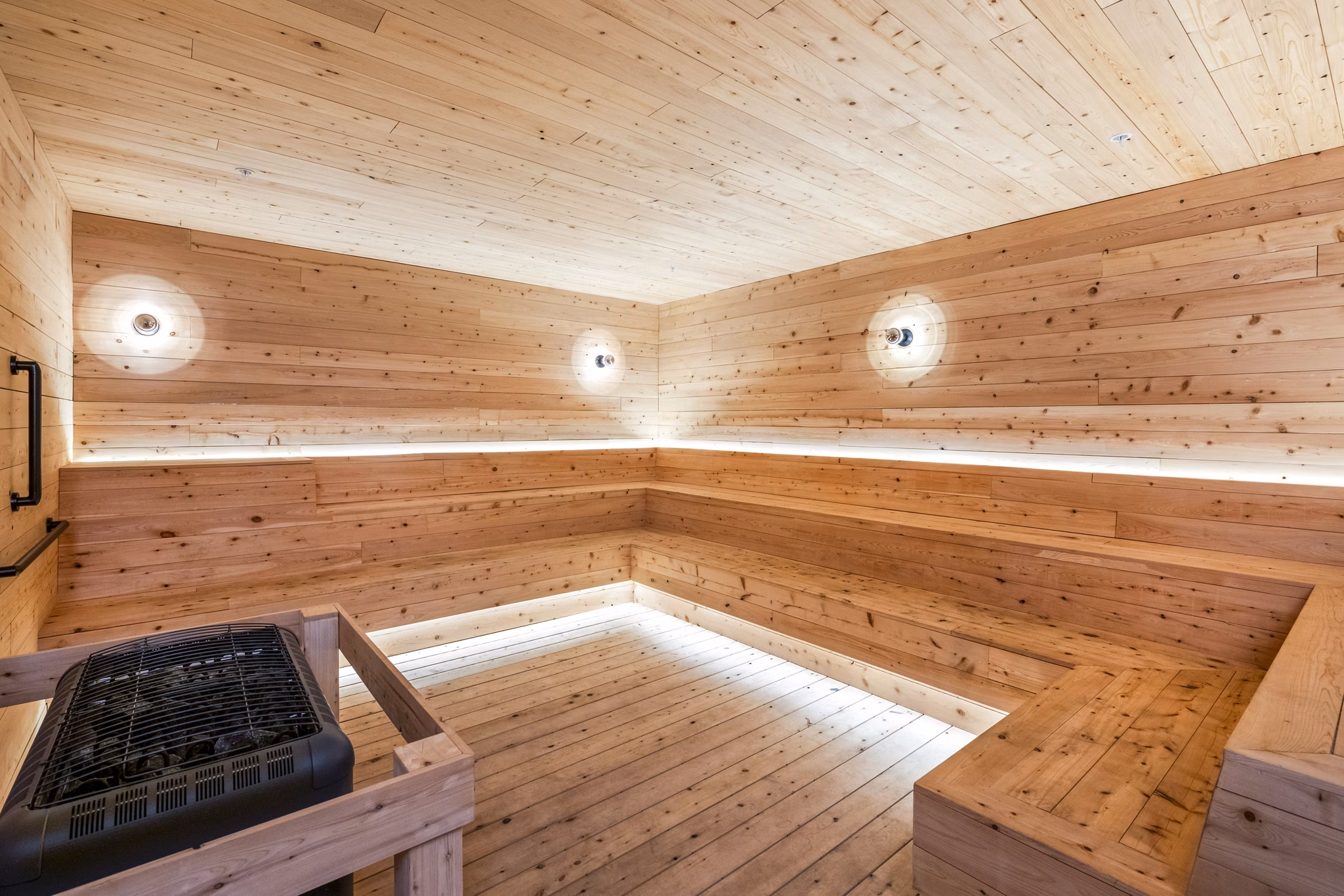 Sauna with cedar benches at FoundryLine Apartments: luxury amenity for relaxation and wellness