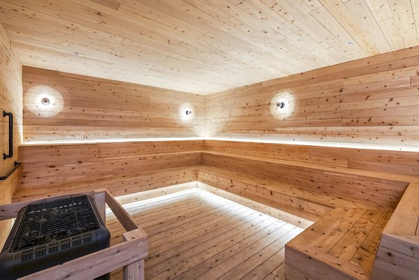 Sauna with cedar benches at FoundryLine Apartments: luxury amenity for relaxation and wellness
