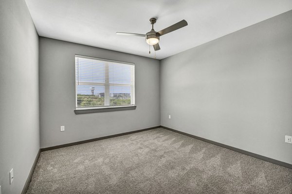 Haven at Mansfield Apartments: Cozy bedroom with stylish decor and ample natural light