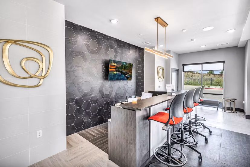 Clubhouse featuring modern seating and large-screen TVs at Haven at Mansfield Apartments