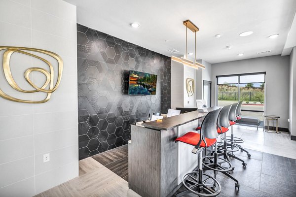 Clubhouse featuring modern seating and large-screen TVs at Haven at Mansfield Apartments