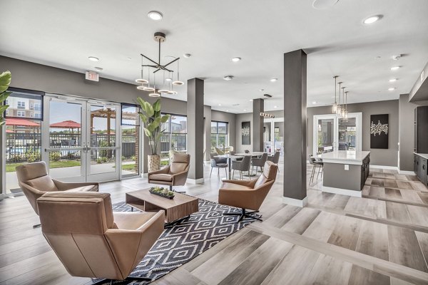 Clubhouse featuring modern decor and spacious seating at Haven at Mansfield Apartments