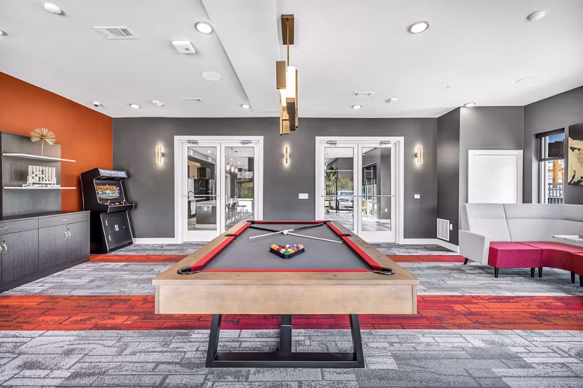 Game room with modern entertainment options at Haven at Mansfield Apartments, featuring stylish furniture and vibrant decor
