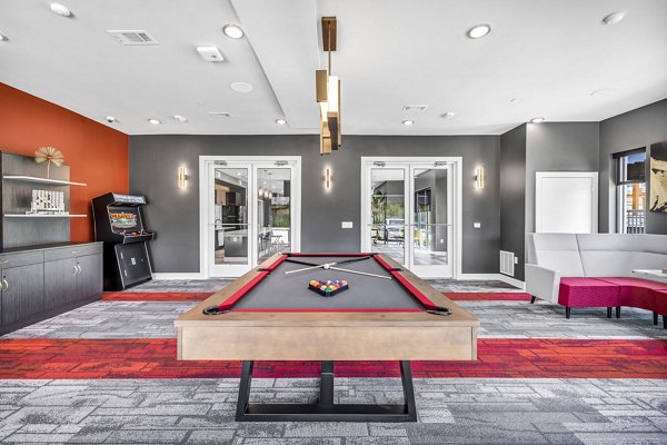 Game room with modern entertainment options at Haven at Mansfield Apartments, featuring stylish furniture and vibrant decor