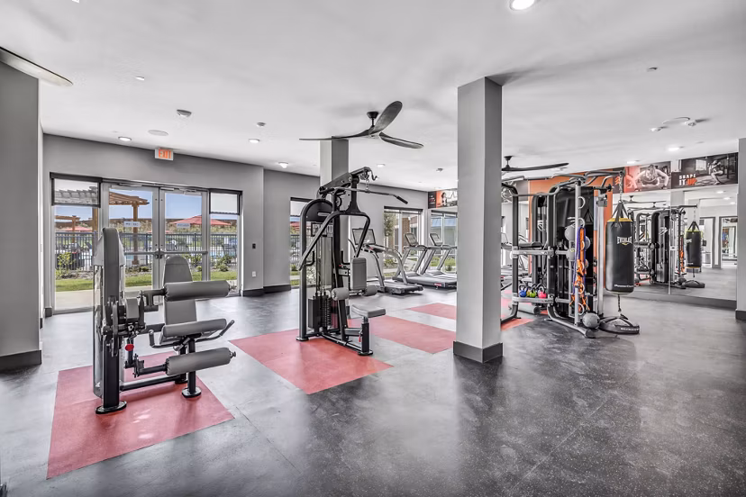 Fitness center equipped with modern exercise machines at Haven at Mansfield Apartments