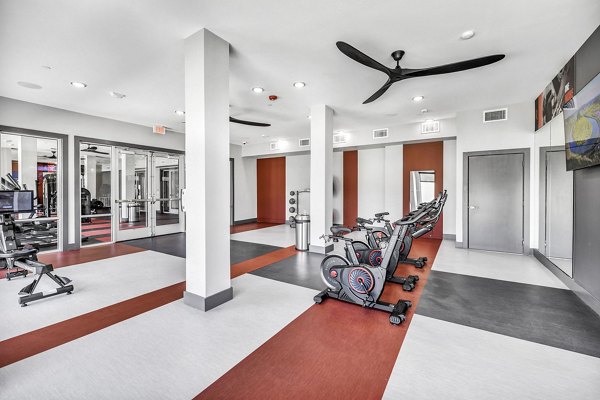 State-of-the-art fitness center at Haven at Mansfield Apartments featuring modern equipment and spacious workout areas for residents