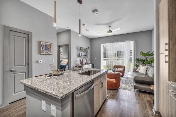 Sleek modern kitchen featuring stainless steel appliances at Haven at Mansfield Apartments
