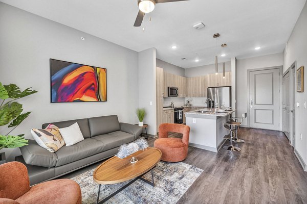 Cozy living room with plush seating and modern decor in Haven at Mansfield Apartments