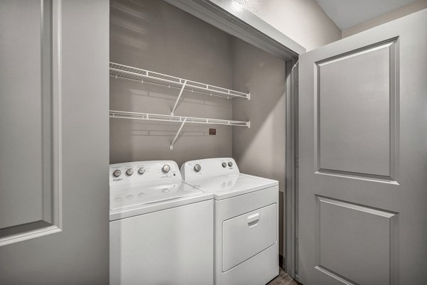 Laundry room with modern appliances in Haven at Mansfield Apartments
