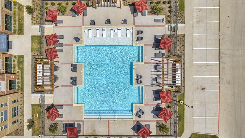 Inviting pool with lounge chairs at Haven at Mansfield Apartments