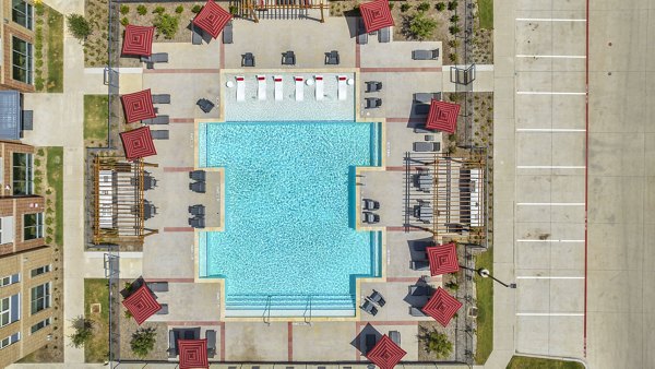 Inviting pool with lounge chairs at Haven at Mansfield Apartments