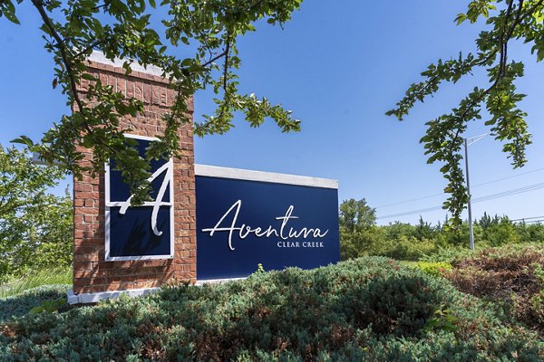 Signage at Aventura Clear Creek Apartments showcasing luxury living in a serene and vibrant community