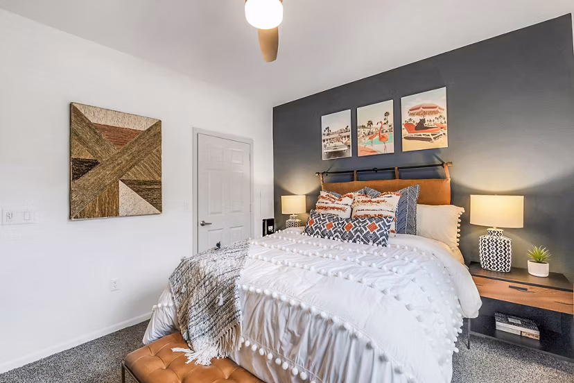 Cozy bedroom with modern decor and ample natural light at Aventura Clear Creek Apartments