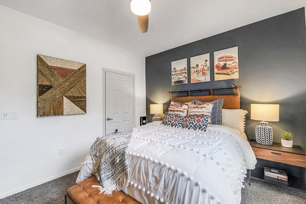 Cozy bedroom with modern decor and ample natural light at Aventura Clear Creek Apartments