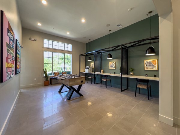 Game room featuring pool table and arcade games at Aventura Clear Creek Apartments: a luxury space designed for entertainment and relaxation