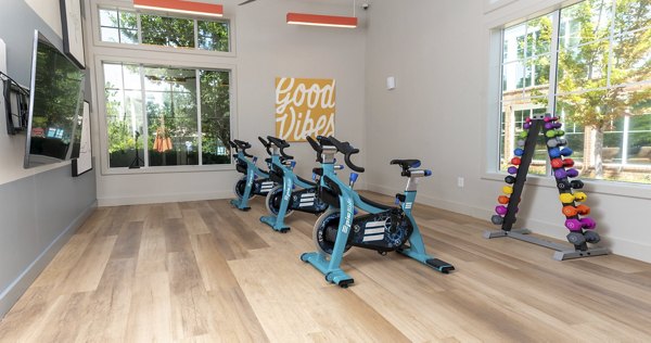 Bright yoga/spin studio featuring modern equipment at Aventura Clear Creek Apartments for fitness-focused residents