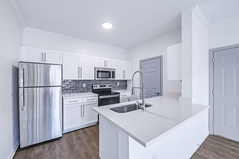 Modern kitchen with stainless steel appliances at Aventura Clear Creek Apartments