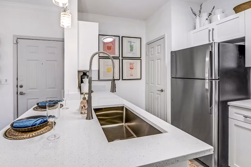 Modern kitchen with stainless steel appliances at Aventura Clear Creek Apartments