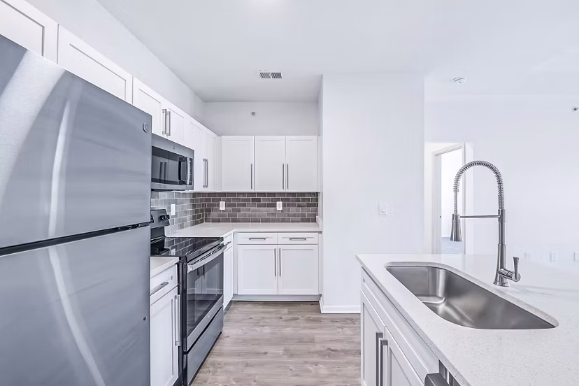 Modern kitchen featuring stainless steel appliances at Aventura Clear Creek Apartments