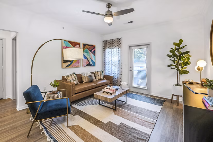 Spacious living room with modern decor in Aventura Clear Creek Apartments