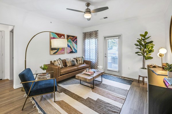 Spacious living room with modern decor in Aventura Clear Creek Apartments