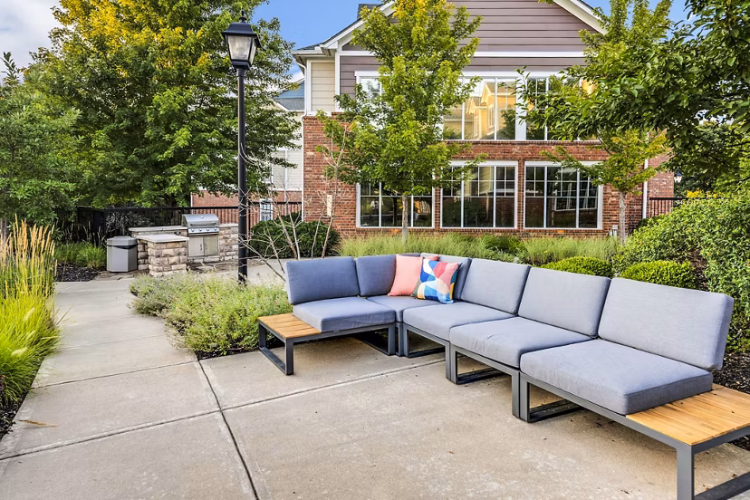 Outdoor patio with a modern grill area at Aventura Clear Creek Apartments, perfect for relaxation and socializing