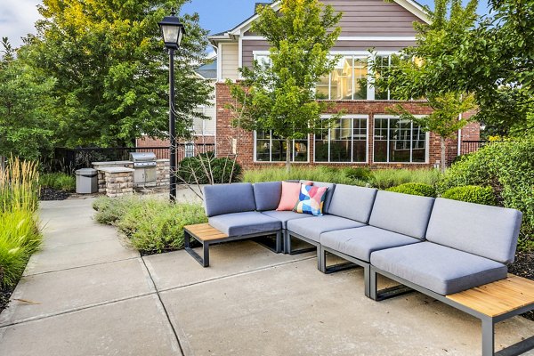 Outdoor patio with a modern grill area at Aventura Clear Creek Apartments, perfect for relaxation and socializing