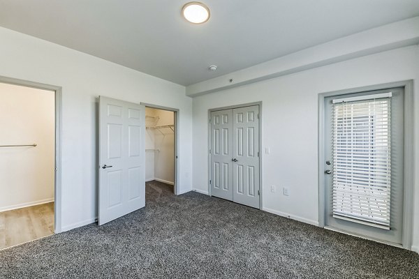 Cozy bedroom with modern decor at Aventura Falcon Valley Apartments luxury rentals