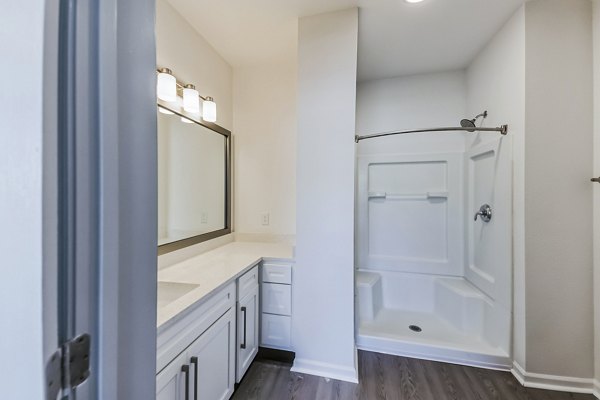 Luxurious bathroom with modern fixtures at Aventura Falcon Valley Apartments