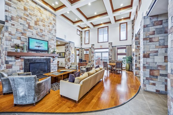 Inviting clubhouse featuring modern decor and comfortable seating at Aventura Falcon Valley Apartments