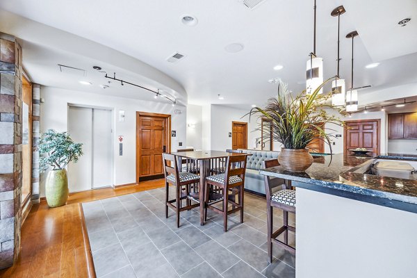 Clubhouse featuring modern design and comfortable seating at Aventura Falcon Valley Apartments