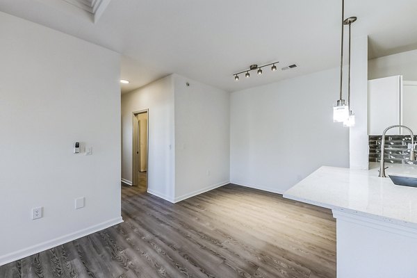 Dining room with elegant lighting and modern decor in Aventura Falcon Valley Apartments