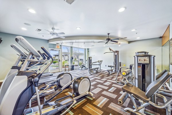 Modern fitness center with state-of-the-art equipment at Aventura Falcon Valley Apartments: a luxury living community
