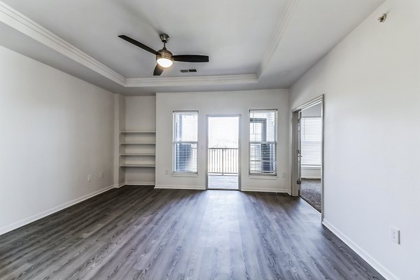 Spacious living room with modern decor in Aventura Falcon Valley Apartments