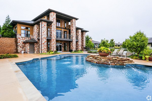 Resort-style pool at Aventura Falcon Valley Apartments, offering luxury amenities and relaxation spaces
