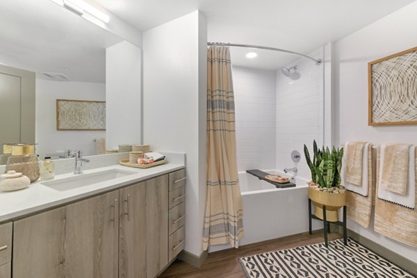 Modern bathroom with sleek fixtures in Persea Apartments