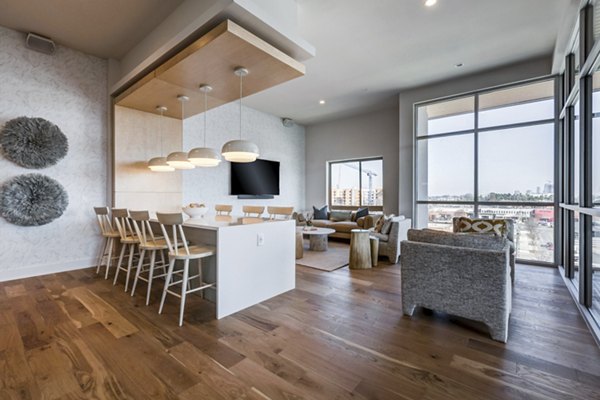 Modern clubhouse with cozy seating area at Ello House Apartments