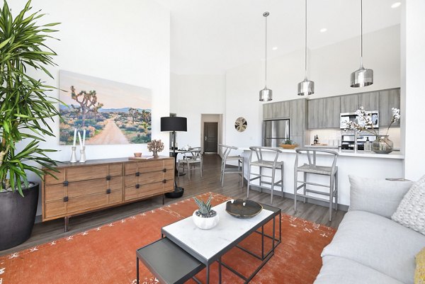 Spacious living room with modern decor and natural light at Persea Apartments, providing luxury living spaces for residents