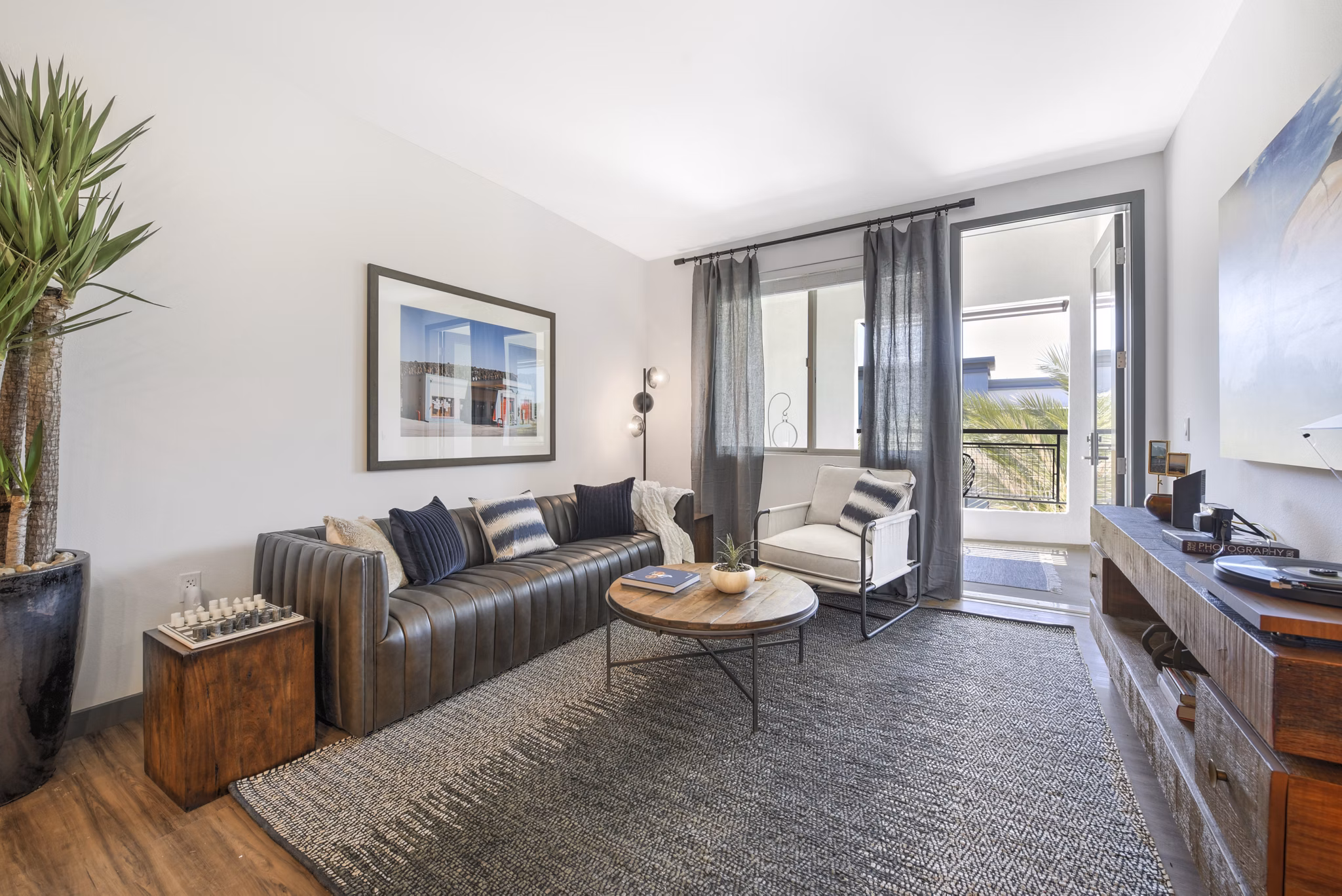 Modern living room with contemporary decor at Persea Apartments, luxury property managed by Greystar