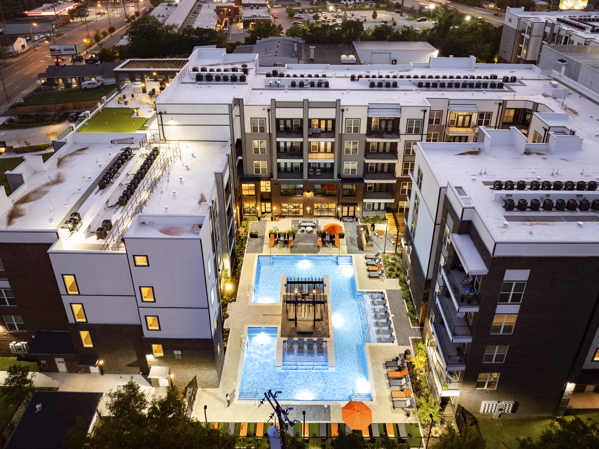 Rye Charlotte Ave Apartments: Stone facade on 12-story luxury apartments in vibrant Charlotte