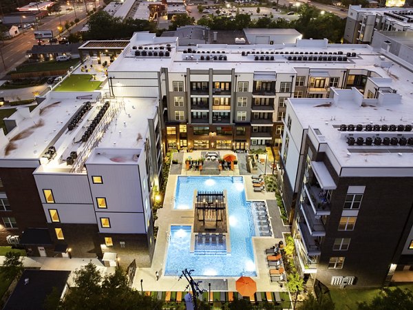 Rye Charlotte Ave Apartments: Stone facade on 12-story luxury apartments in vibrant Charlotte
